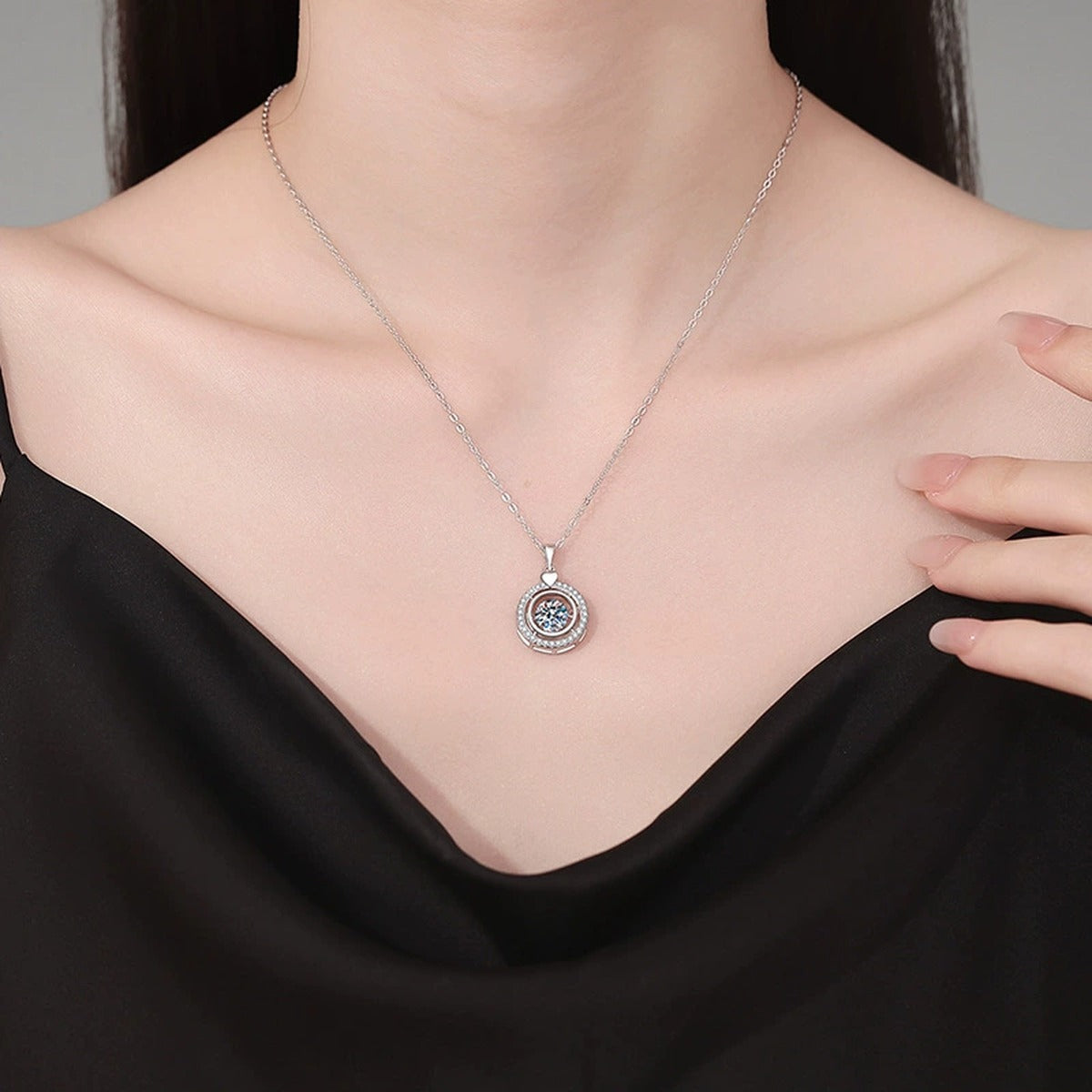 Heart Charm Round Halo Moissanite Pendant Necklace in Platinum-Plated S925 Sterling Silver worn on neckline by model