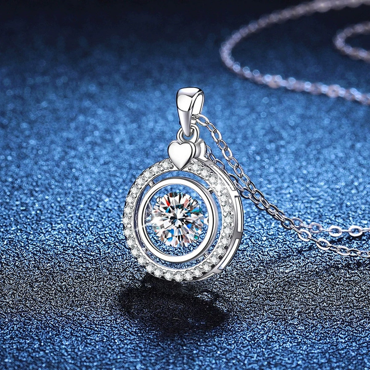 Heart Charm Round Halo Moissanite Pendant Necklace in Platinum-Plated S925 Sterling Silver blue background angled view