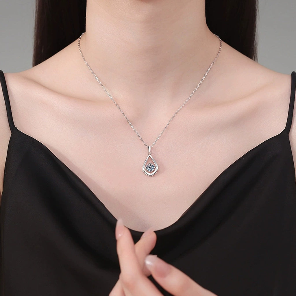Teardrop Halo Moissanite Pendant Necklace in Platinum-Plated S925 Sterling Silver worn on neckline by model