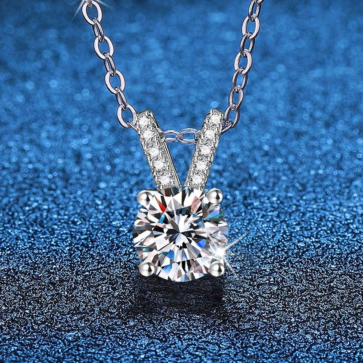Classic Round Moissanite Solitaire Pendant Necklace in Platinum-Plated S925 Sterling Silver blue background product view