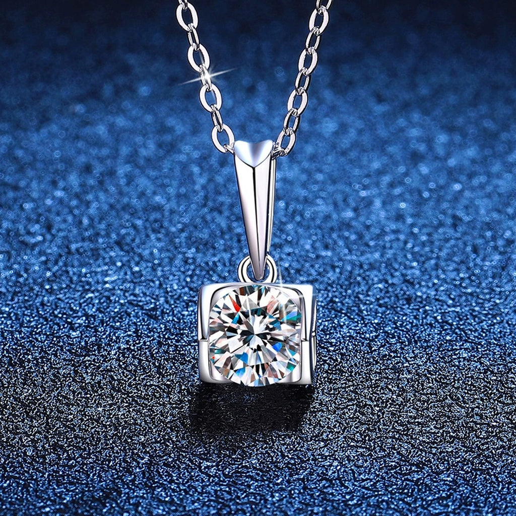 Square Frame Moissanite Pendant Necklace in Platinum-Plated S925 Sterling Silver blue background angled view