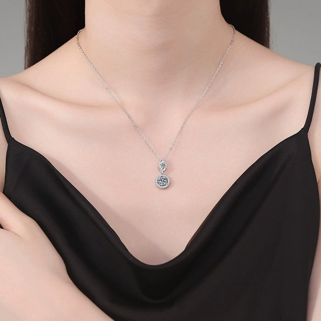 Double Halo Drop Moissanite Pendant Necklace in Platinum-Plated S925 Sterling Silver worn on neckline by model