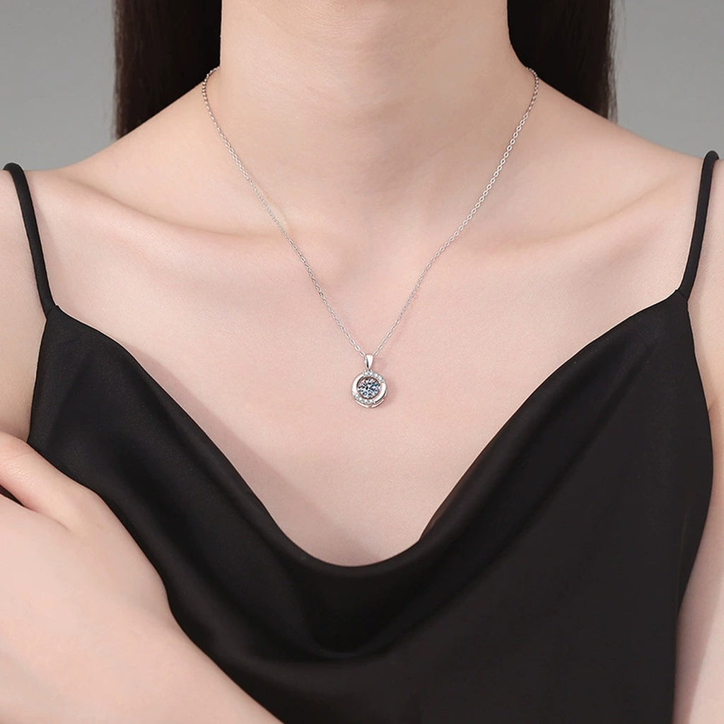 Crescent Halo Moissanite Pendant Necklace in Platinum-Plated S925 Sterling Silver worn on neckline by model