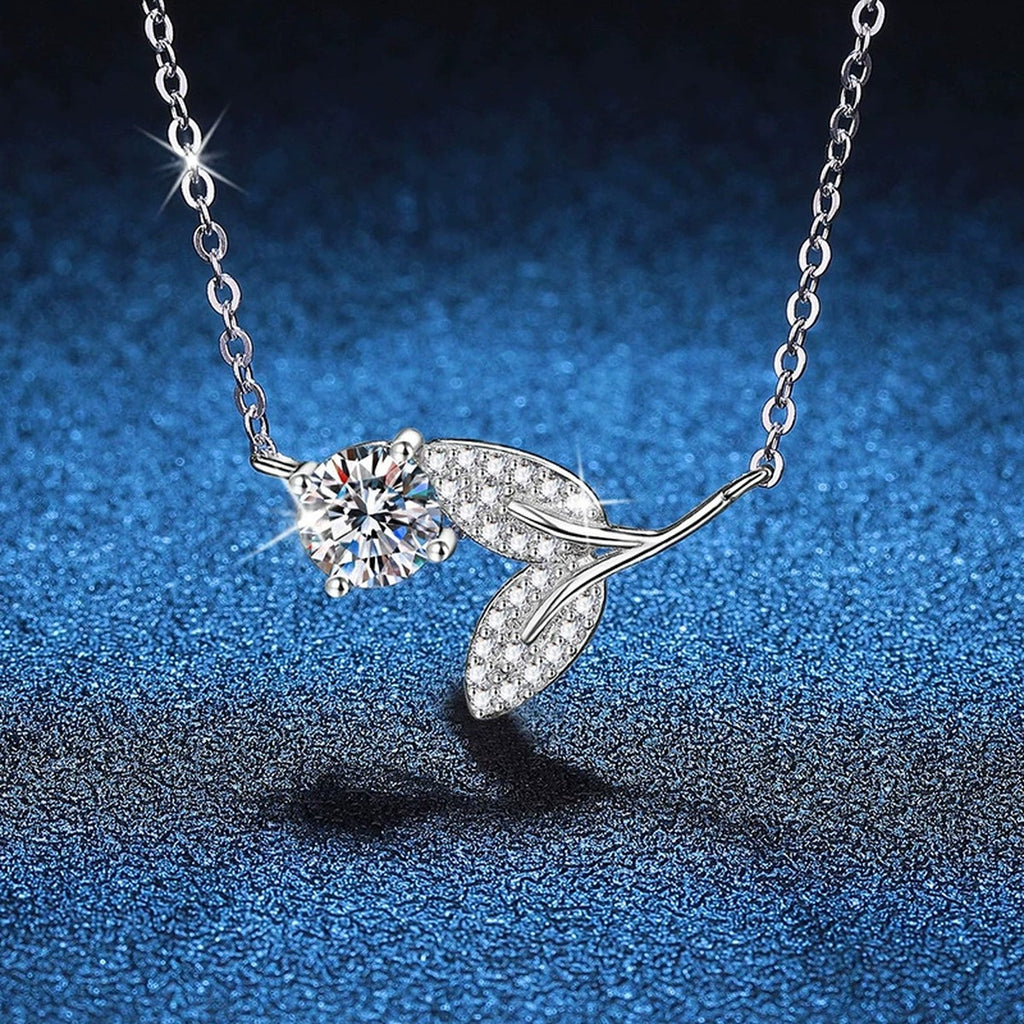 Leaf Vine Moissanite Pendant Necklace in Platinum-Plated S925 Sterling Silver blue background angled view