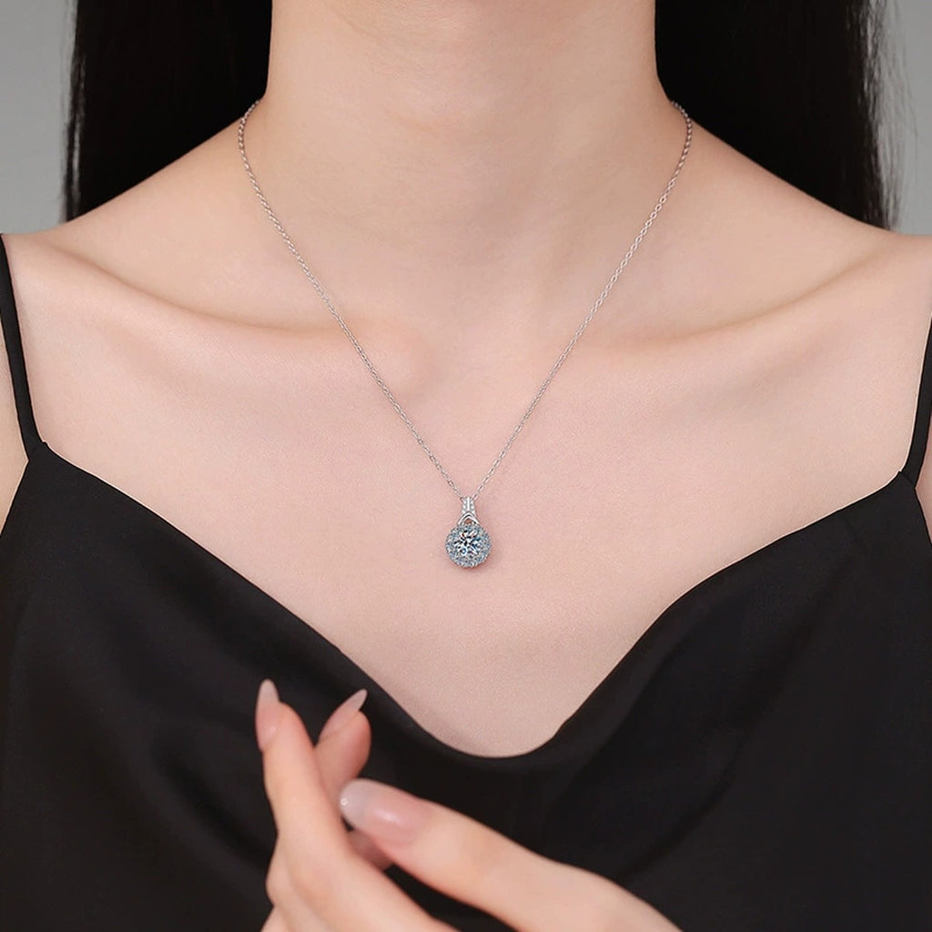 Round Halo Moissanite Pendant Necklace in Platinum-Plated S925 Sterling Silver worn on neckline by model