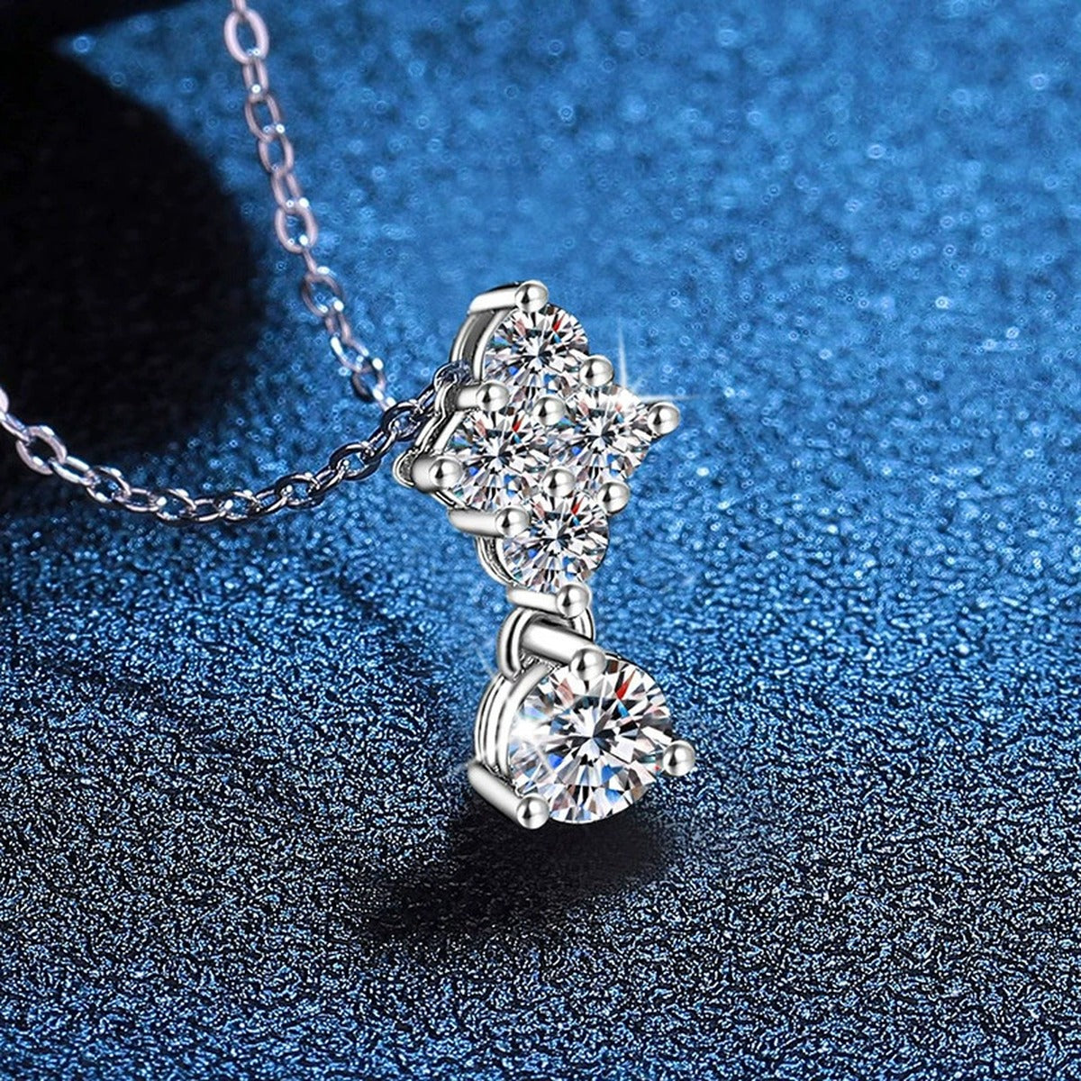 Graduated Cluster Moissanite Drop Necklace in Platinum-Plated S925 Sterling Silver blue background product view