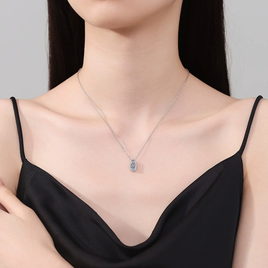 Teardrop Cluster Moissanite Pendant Necklace in Platinum-Plated S925 Sterling Silver worn on neckline by model