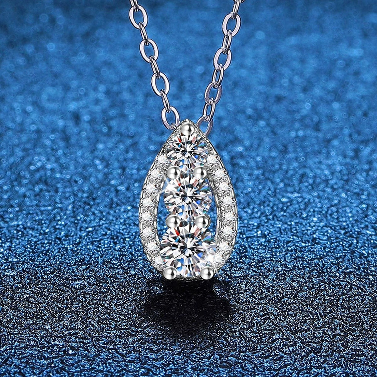 Teardrop Cluster Moissanite Pendant Necklace in Platinum-Plated S925 Sterling Silver blue background product view