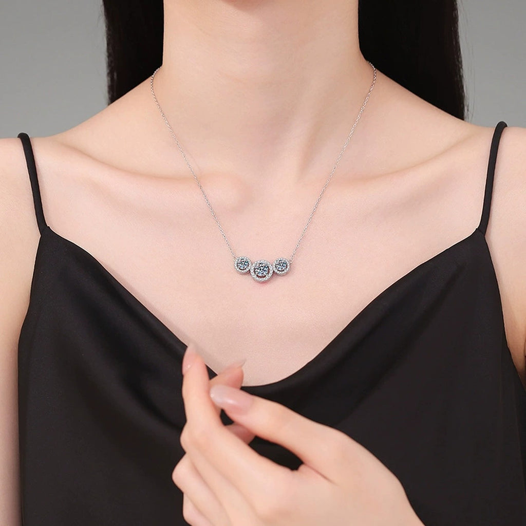 Three-Stone Halo Moissanite Station Necklace in Platinum-Plated S925 Sterling Silver worn on neckline by model