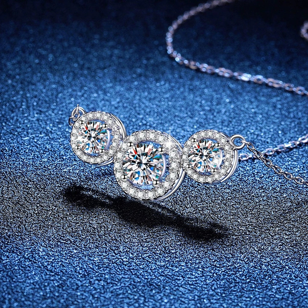 Three-Stone Halo Moissanite Station Necklace in Platinum-Plated S925 Sterling Silver blue background product view