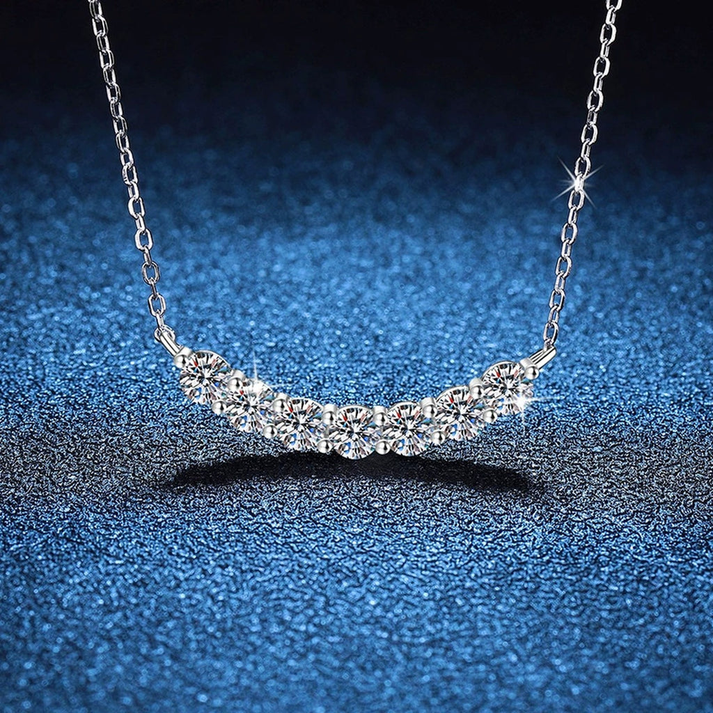 Graduated Moissanite Collar Necklace in Platinum-Plated S925 Sterling Silver blue background angled view