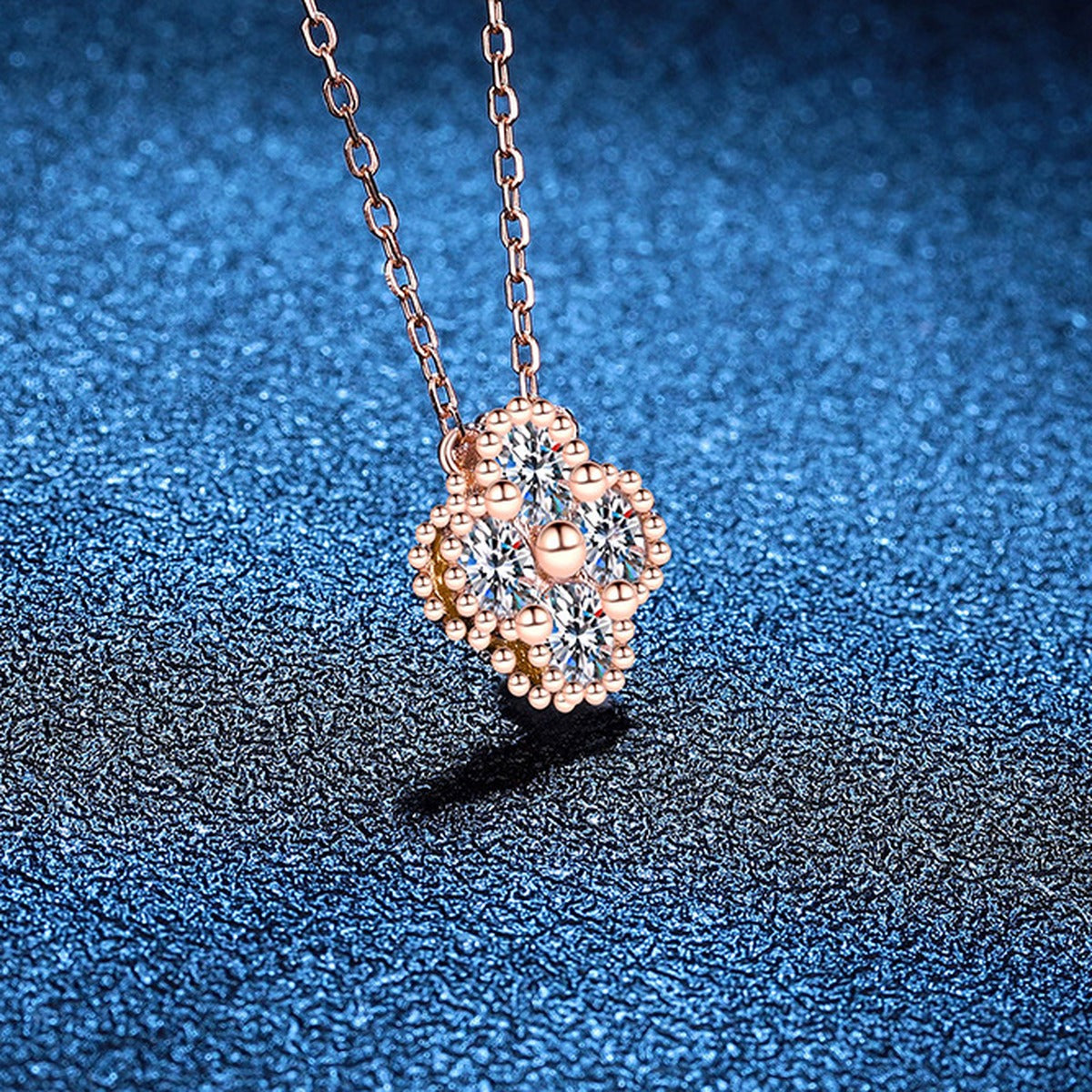 Four-Stone Clover Moissanite Pendant Necklace in S925 Sterling Silver blue background product view