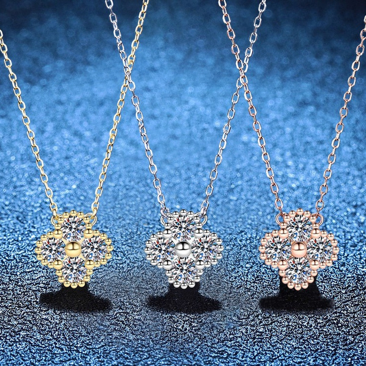 Four-Stone Clover Moissanite Pendant Necklace in S925 Sterling Silver blue background close-up view