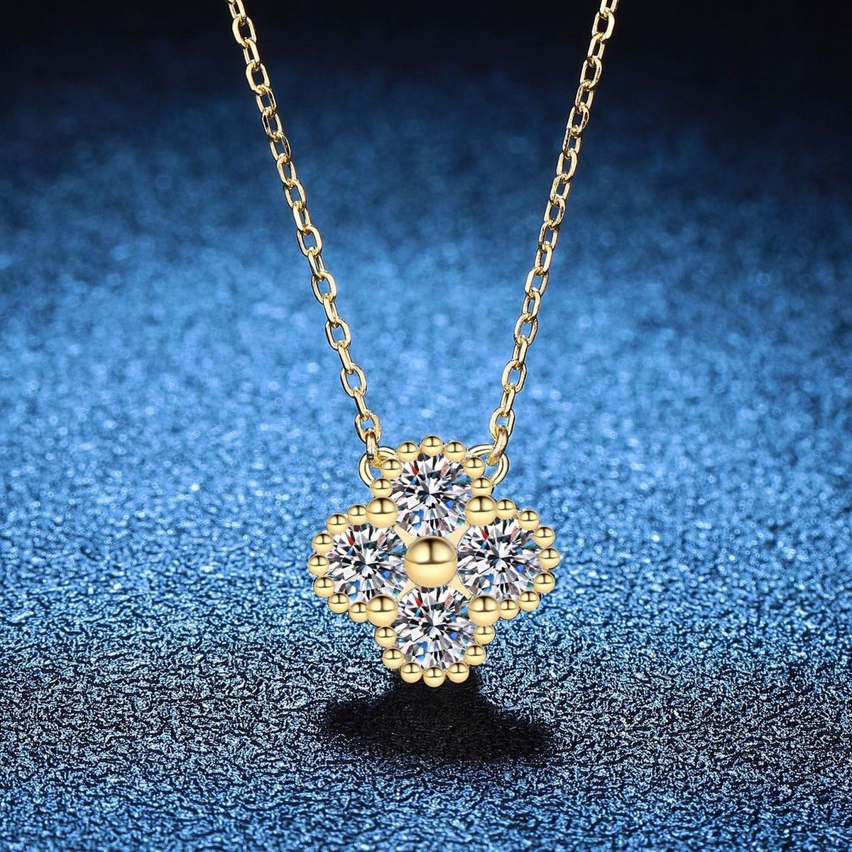 Four-Stone Clover Moissanite Pendant Necklace in S925 Sterling Silver blue background styling view