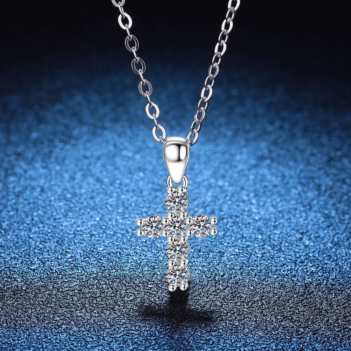 Cross Moissanite Pendant Necklace in S925 Sterling Silver blue background styling view