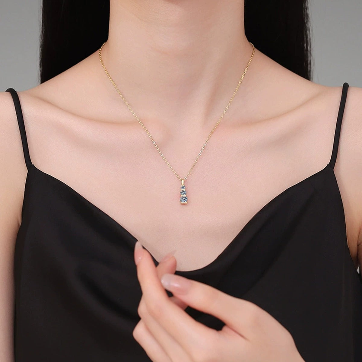 Vertical Three-Stone Moissanite Bar Necklace in 14K Yellow Gold-Plated S925 Sterling Silver worn on neckline by model