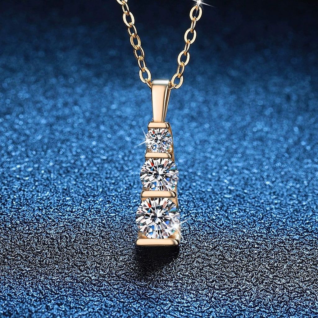 Vertical Three-Stone Moissanite Bar Necklace in 14K Yellow Gold-Plated S925 Sterling Silver blue background close-up view