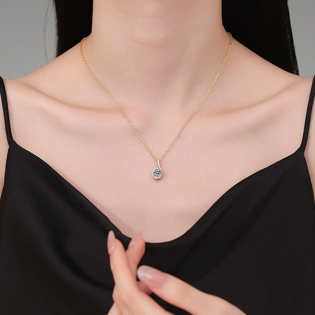 Curved Loop Moissanite Pendant Necklace in S925 Sterling Silver worn on neckline by model