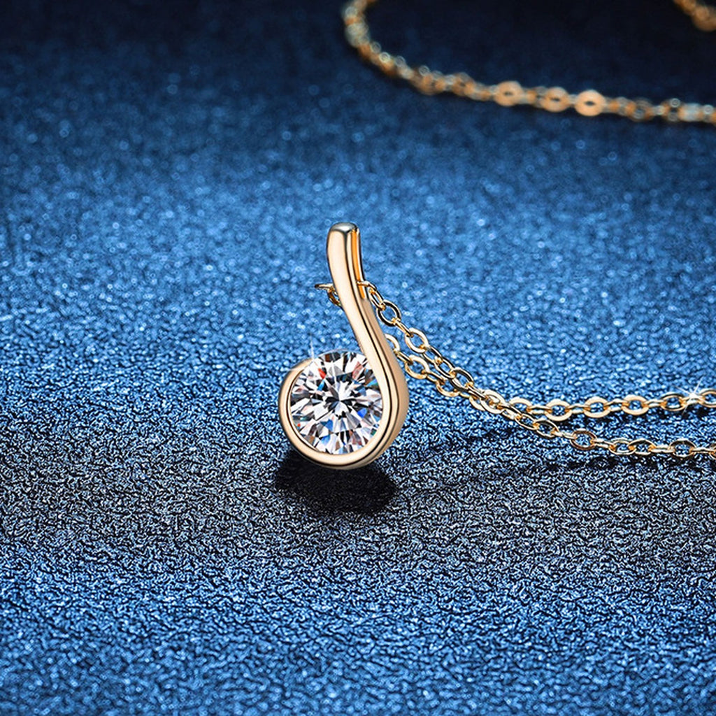 Curved Loop Moissanite Pendant Necklace in S925 Sterling Silver blue background close-up view