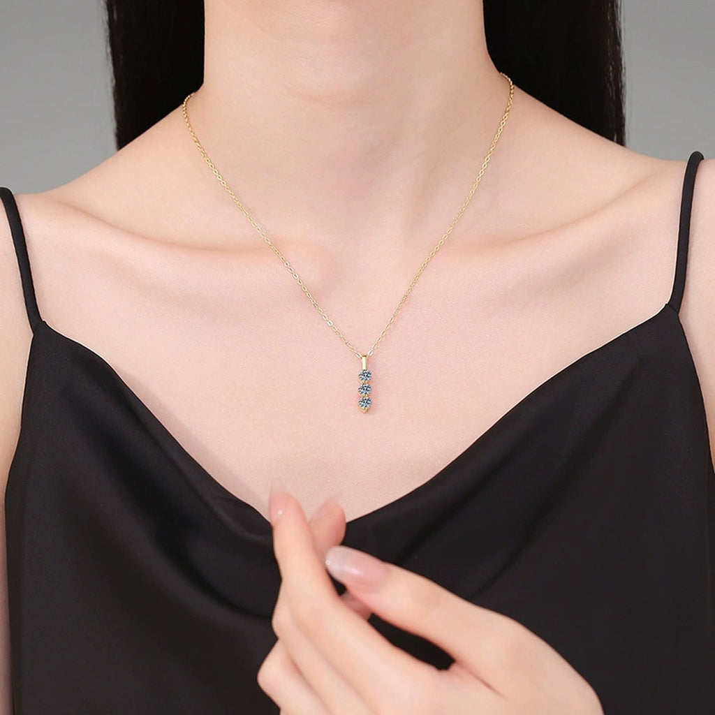 Vertical Three-Stone Moissanite Drop Necklace in S925 Sterling Silver worn on neckline by model