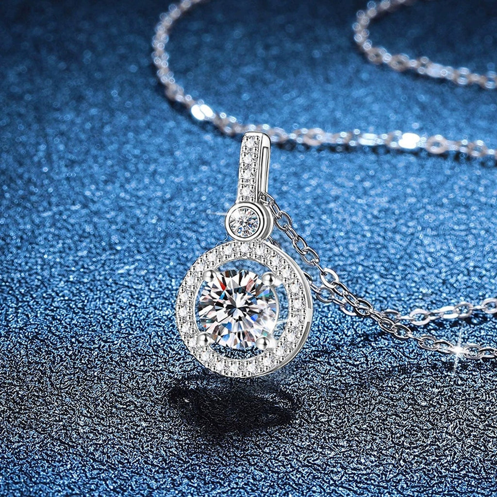 Round Halo Drop Moissanite Pendant Necklace in Platinum-Plated S925 Sterling Silver blue background product view