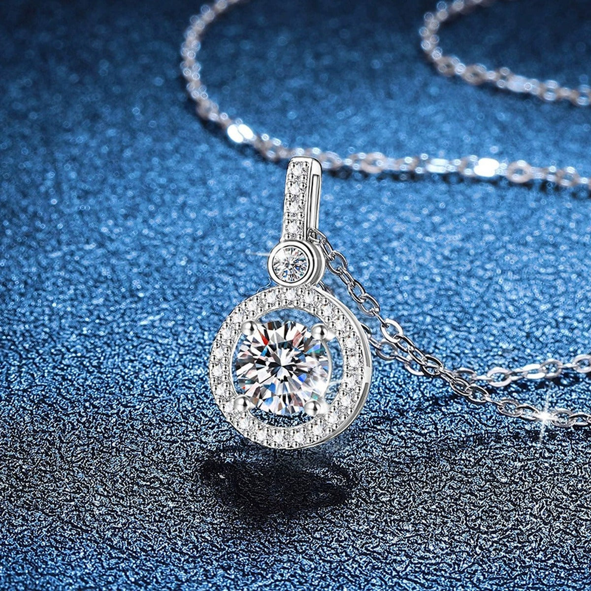 Round Halo Drop Moissanite Pendant Necklace in Platinum-Plated S925 Sterling Silver blue background product view