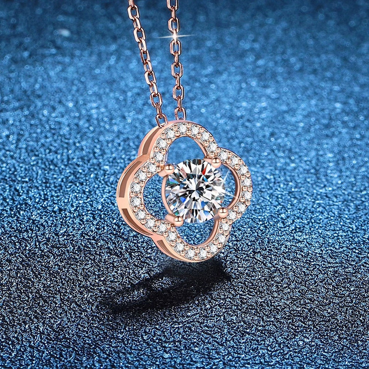 Clover Halo Moissanite Pendant Necklace in Rose Gold-Plated S925 Sterling Silver blue background close-up view