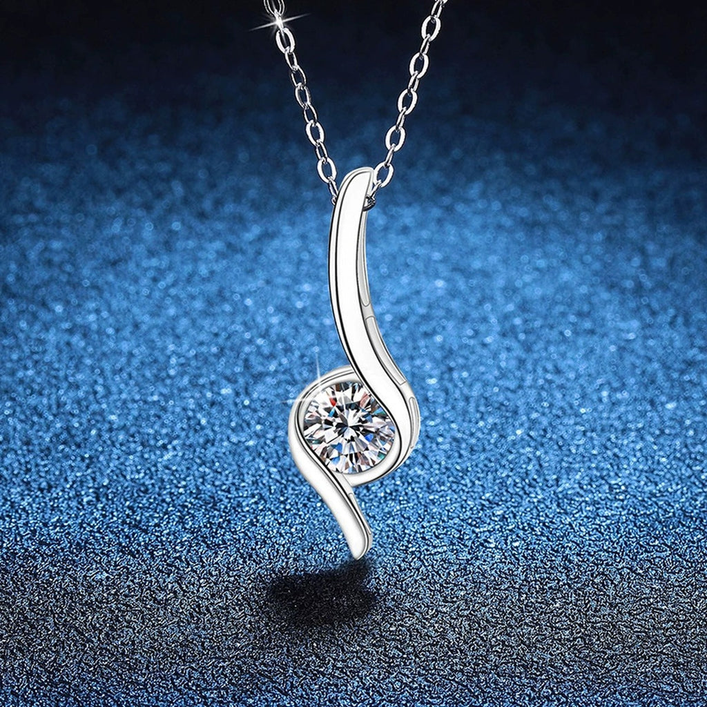 Curved Line Moissanite Pendant Necklace in Platinum-Plated S925 Sterling Silver blue background angled view