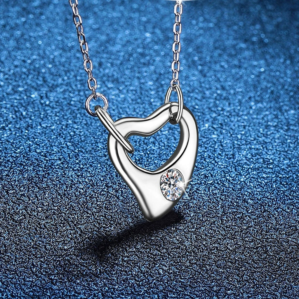 Open Heart Knot Moissanite Pendant Necklace in Platinum-Plated S925 Sterling Silver blue background product view