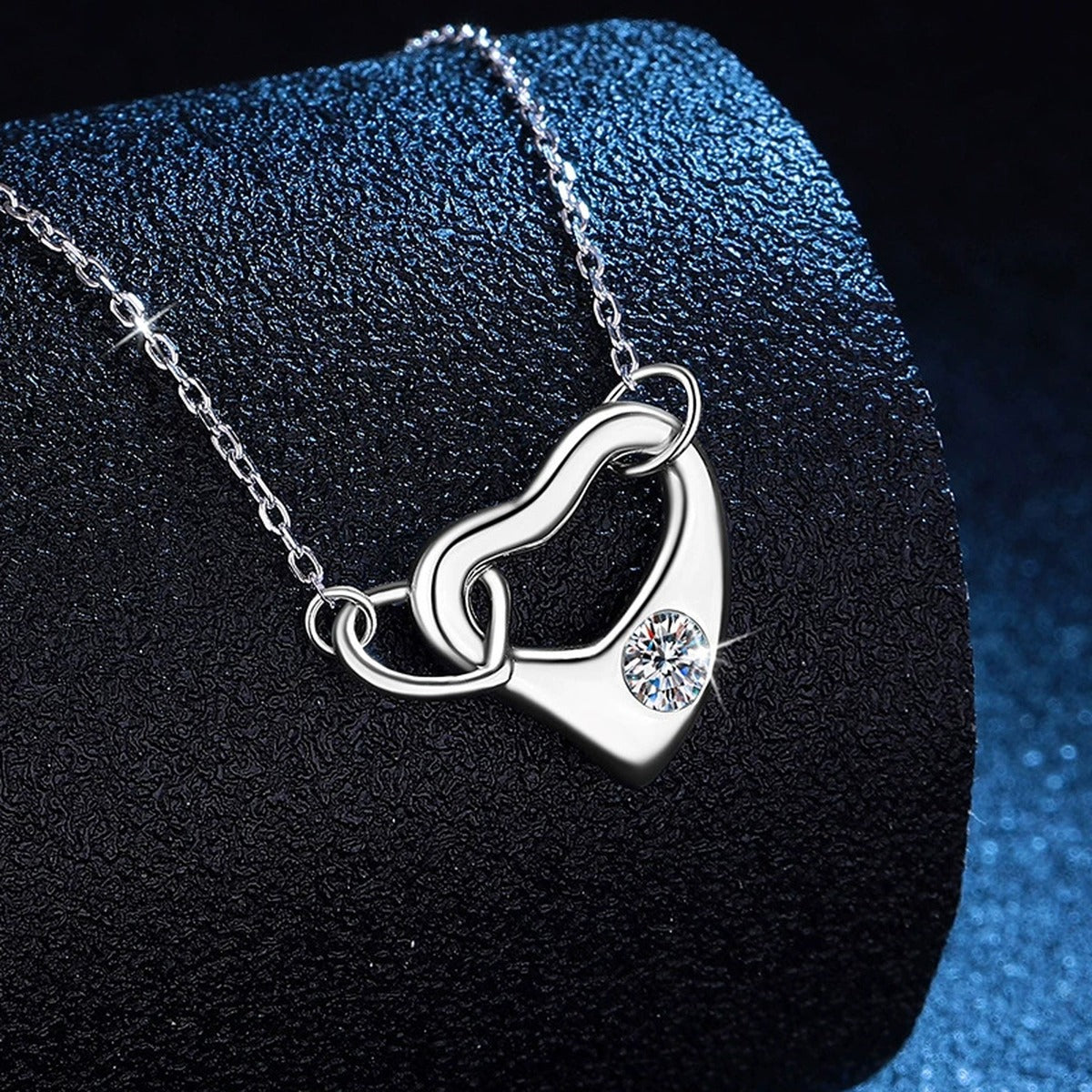 Open Heart Knot Moissanite Pendant Necklace in Platinum-Plated S925 Sterling Silver dark background product display view