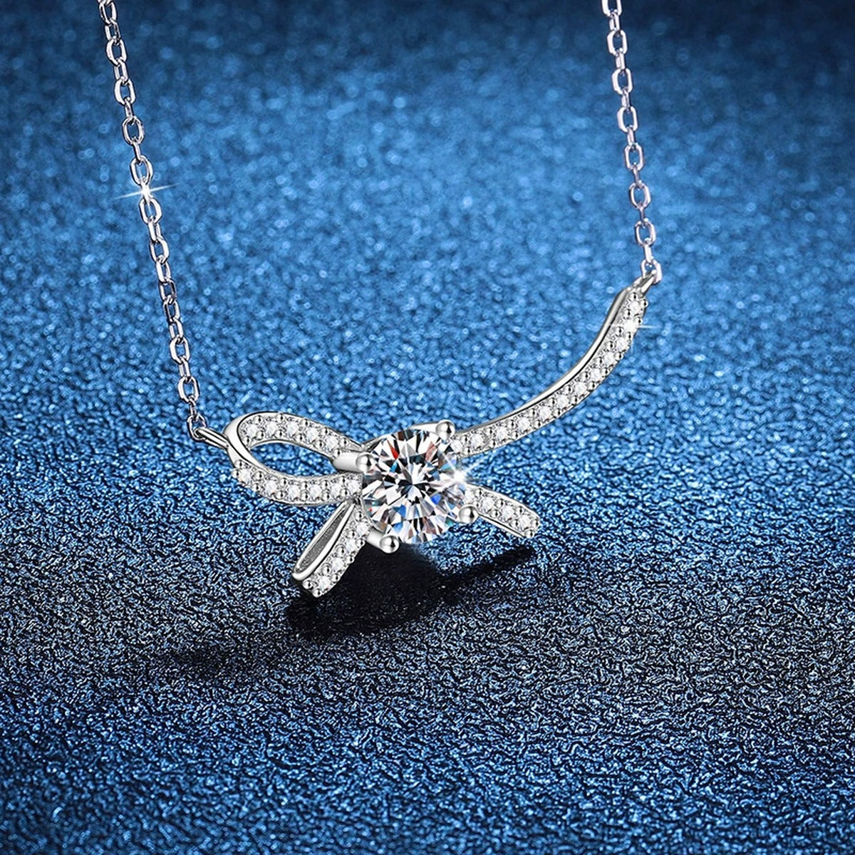 Ribbon Bow Moissanite Collar Necklace in Platinum-Plated S925 Sterling Silver blue background product view