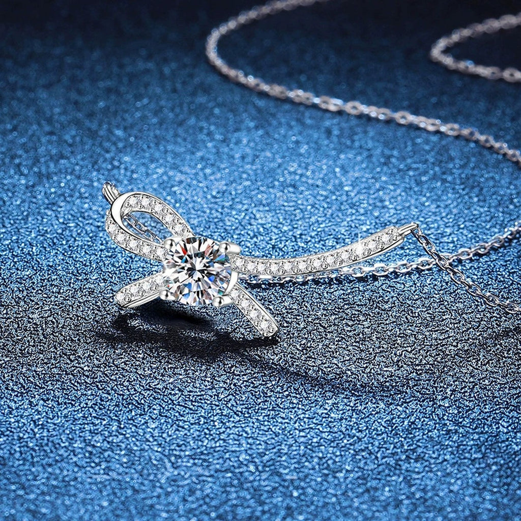 Ribbon Bow Moissanite Collar Necklace in Platinum-Plated S925 Sterling Silver blue background angled view