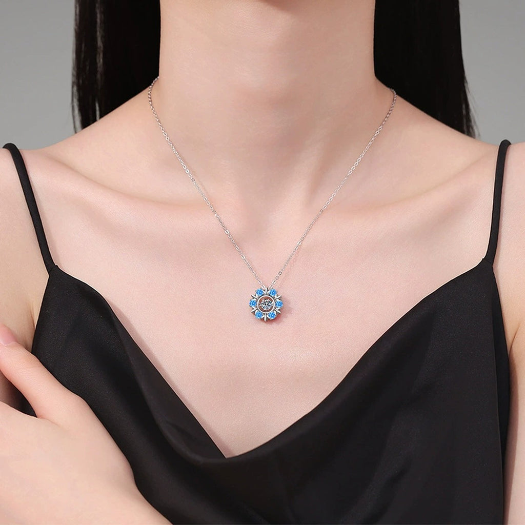 Sunburst Halo Moissanite Pendant Necklace with Cubic Zirconia Side Stones in Platinum-Plated S925 Sterling Silver worn on neckline by model