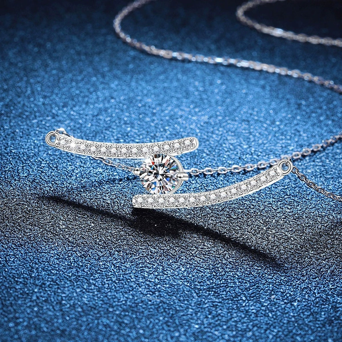 Bypass Bar Moissanite Necklace in Platinum-Plated S925 Sterling Silver blue background close-up view