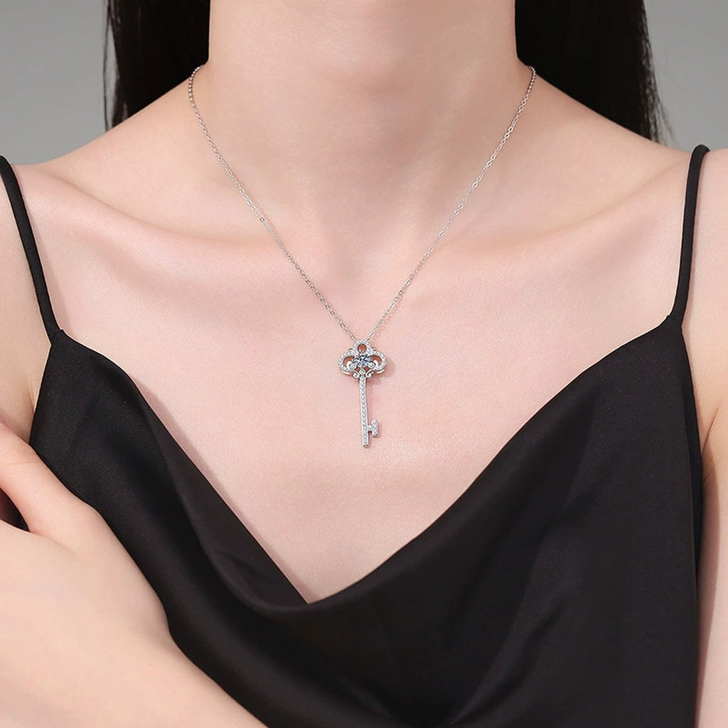 Key Moissanite Pendant Necklace in Platinum-Plated S925 Sterling Silver worn on neckline by model