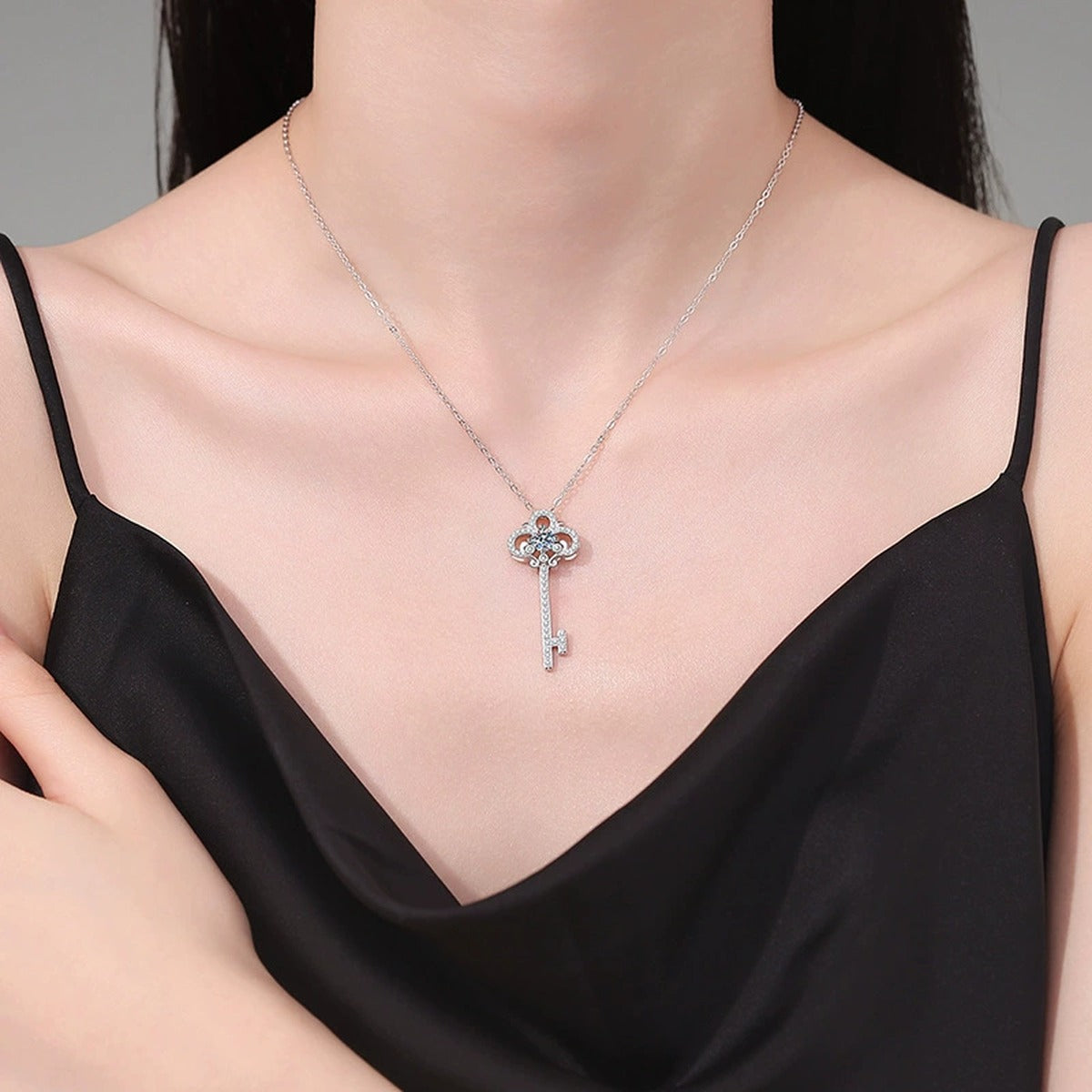 Key Moissanite Pendant Necklace in Platinum-Plated S925 Sterling Silver worn on neckline by model