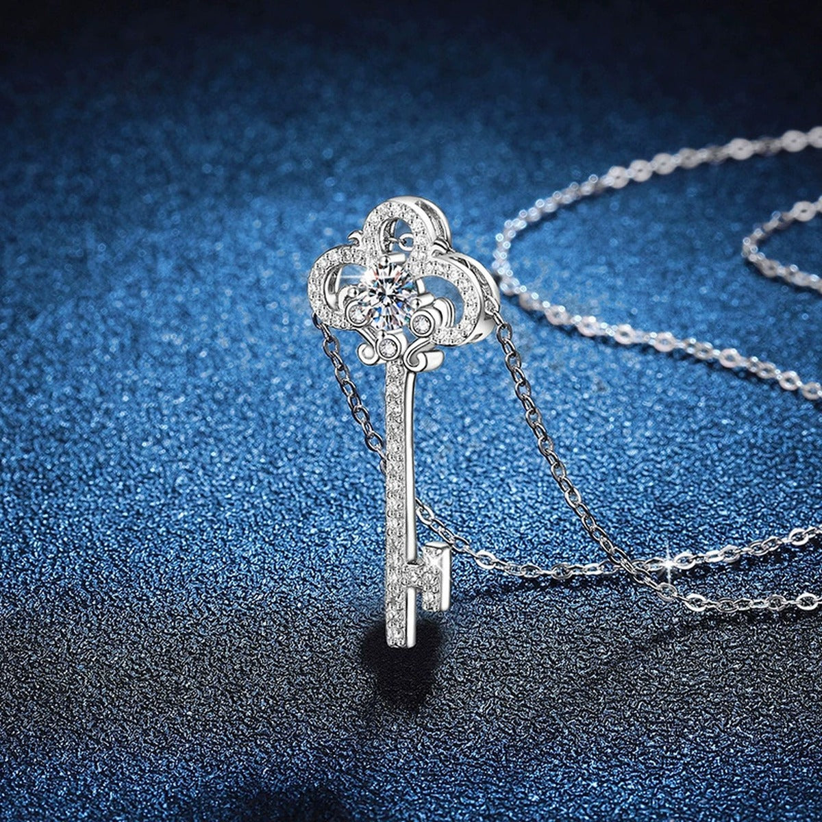 Key Moissanite Pendant Necklace in Platinum-Plated S925 Sterling Silver blue background angled view