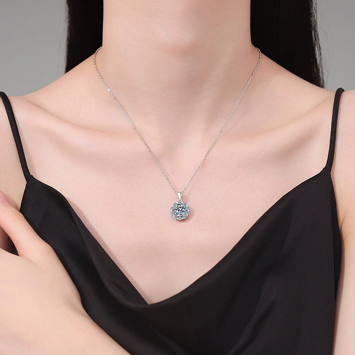 Floral Halo Moissanite Pendant Necklace in Platinum-Plated S925 Sterling Silver worn on neckline by model