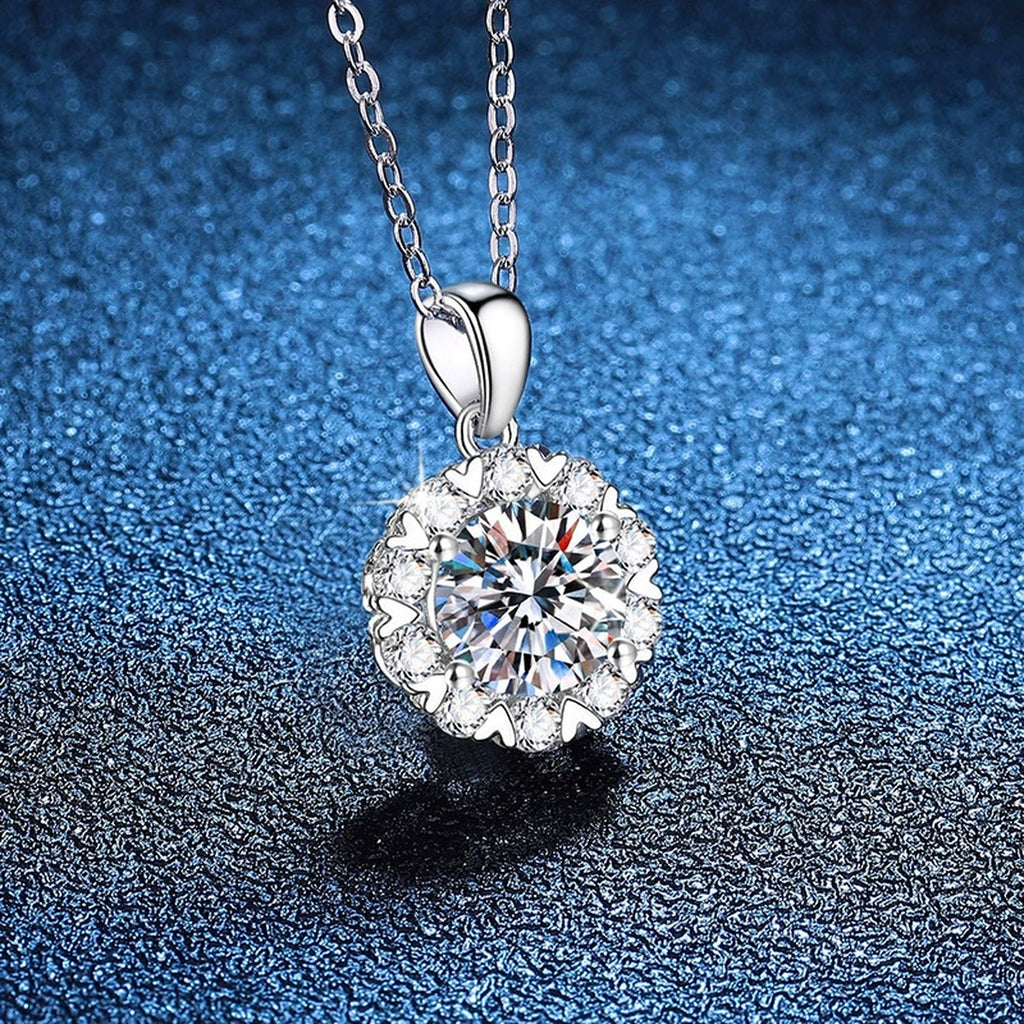 Floral Halo Moissanite Pendant Necklace in Platinum-Plated S925 Sterling Silver blue background angled view
