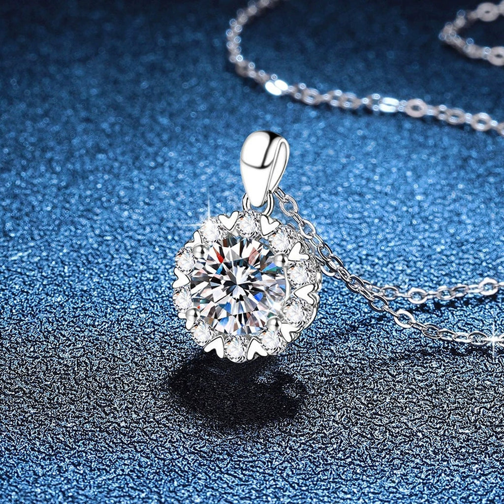 Floral Halo Moissanite Pendant Necklace in Platinum-Plated S925 Sterling Silver blue background close-up view