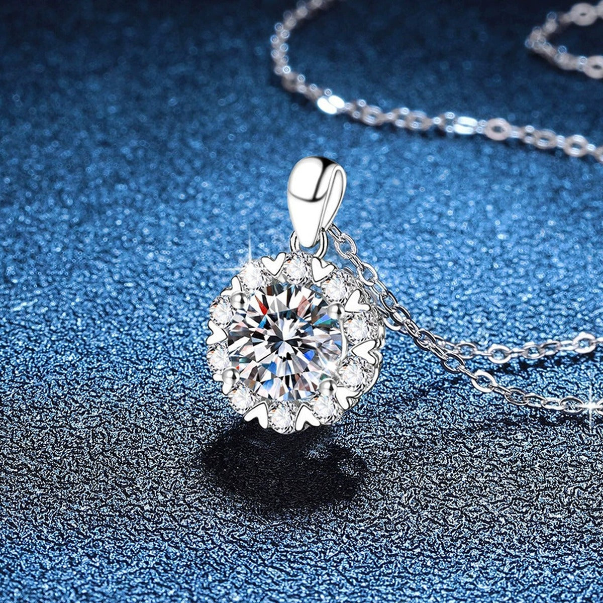 Floral Halo Moissanite Pendant Necklace in Platinum-Plated S925 Sterling Silver blue background close-up view