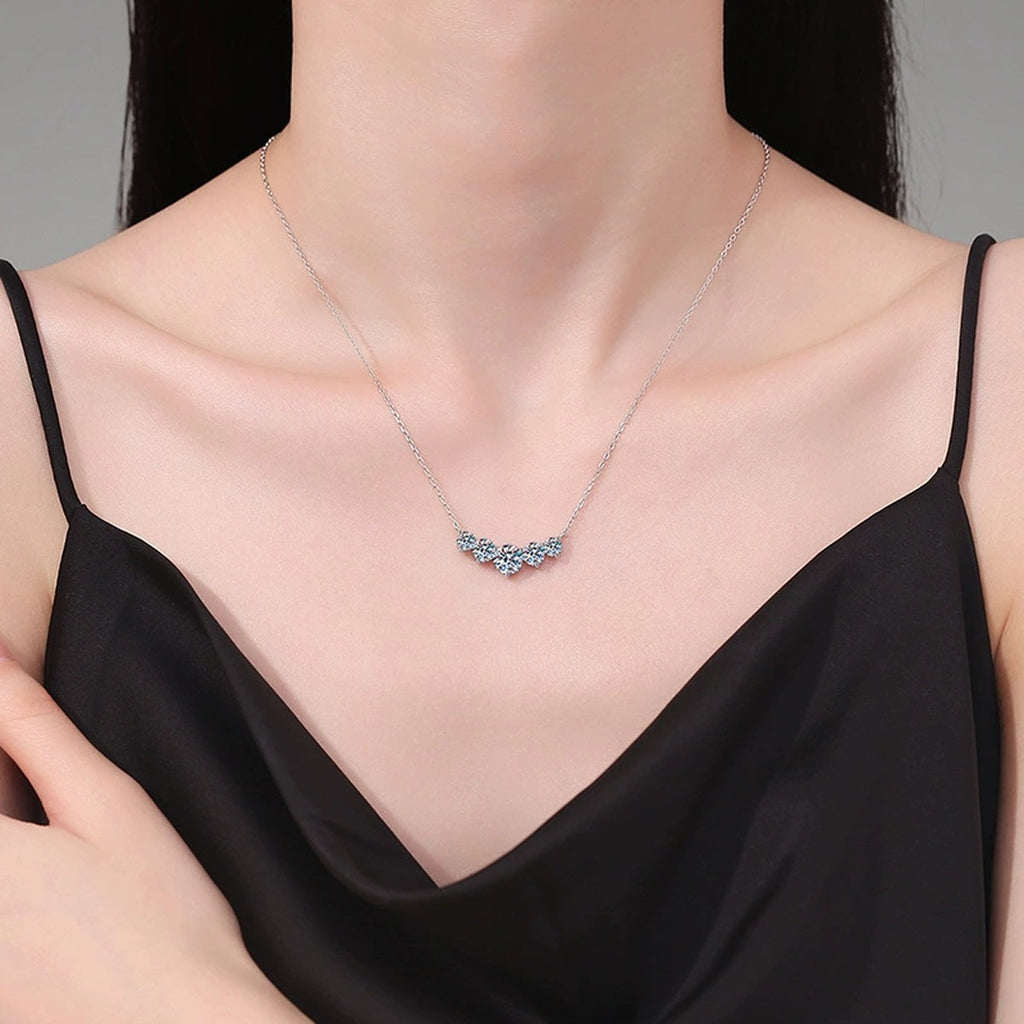 Five-Stone Graduated Moissanite Collar Necklace in Platinum-Plated S925 Sterling Silver worn on neckline by model