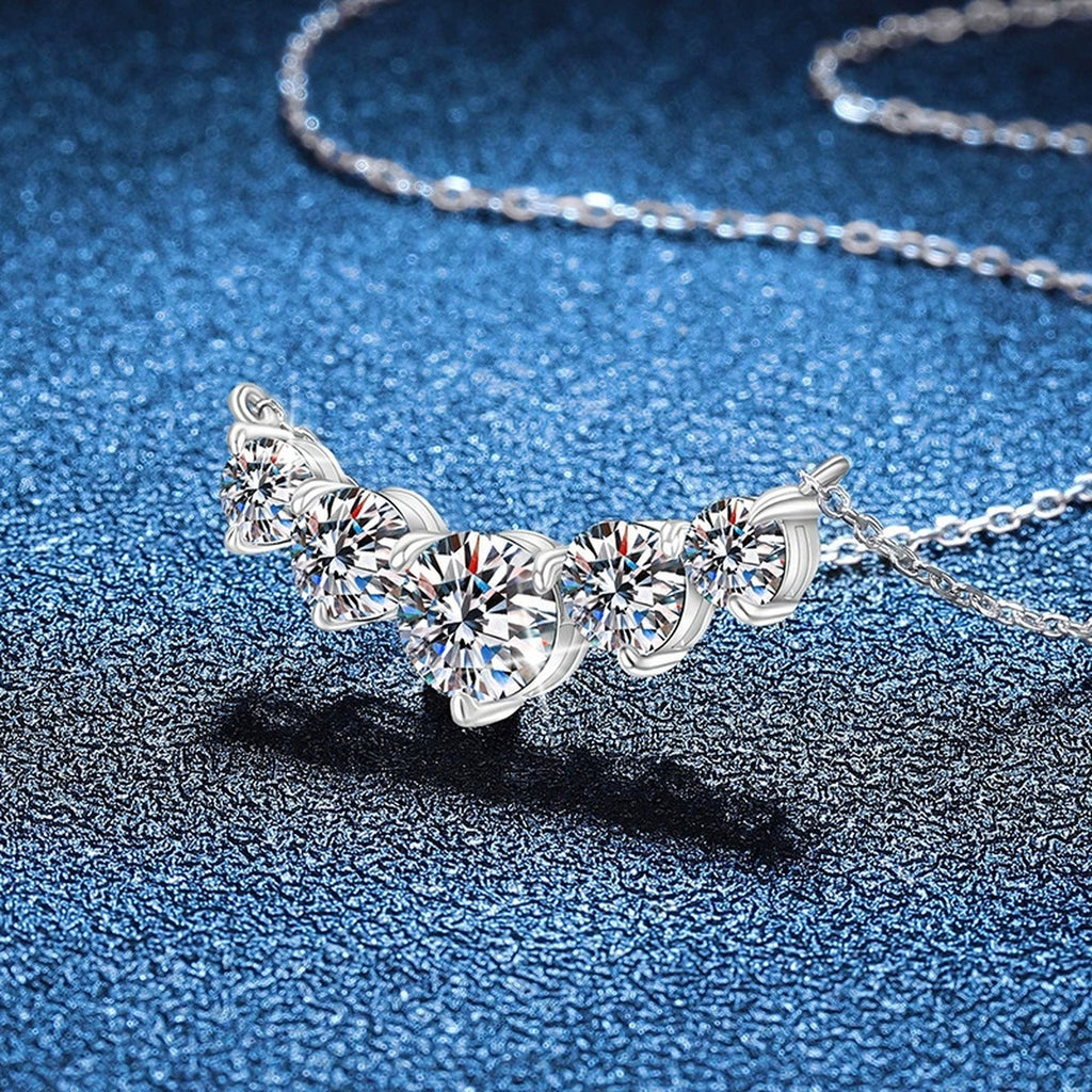 Five-Stone Graduated Moissanite Collar Necklace in Platinum-Plated S925 Sterling Silver blue background close-up view
