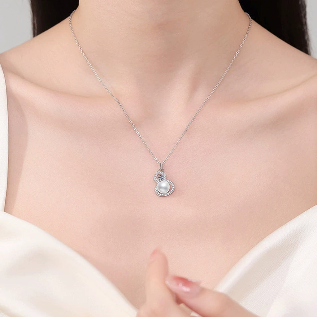 Swirl Moissanite Freshwater Pearl Pendant Necklace with Cubic Zirconia in White Gold-Plated S925 Sterling Silver worn on neckline by model