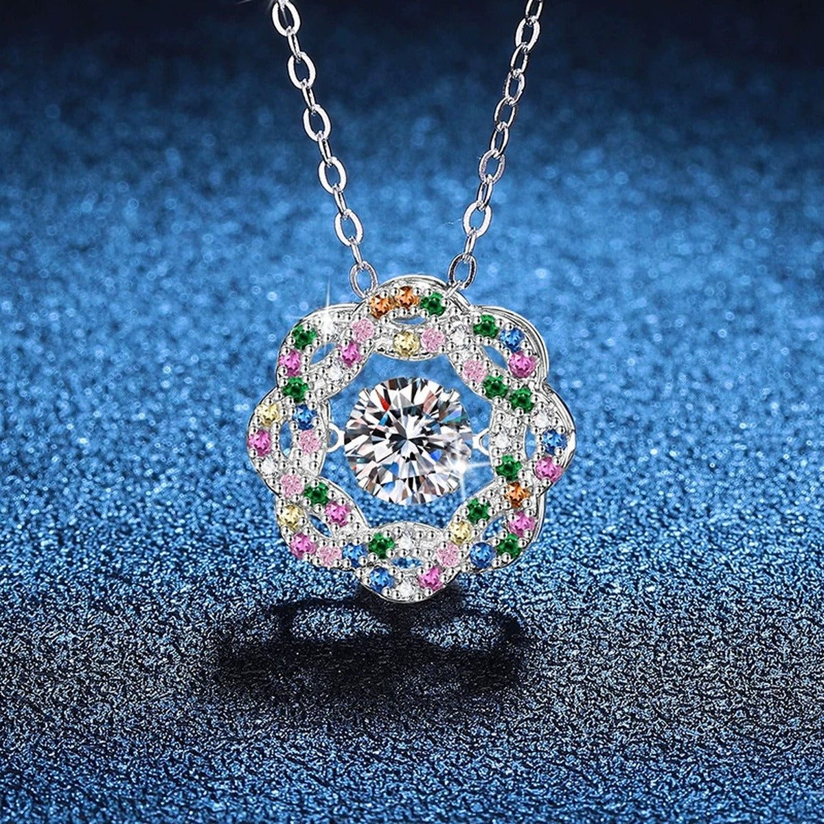 Rainbow Halo Moissanite Pendant Necklace with Cubic Zirconia in Platinum-Plated S925 Sterling Silver blue background angled view