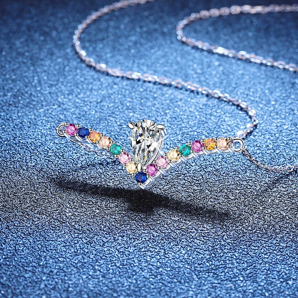 Rainbow Pear-Cut Moissanite Collar Necklace in Platinum-Plated S925 Sterling Silver blue background close-up view