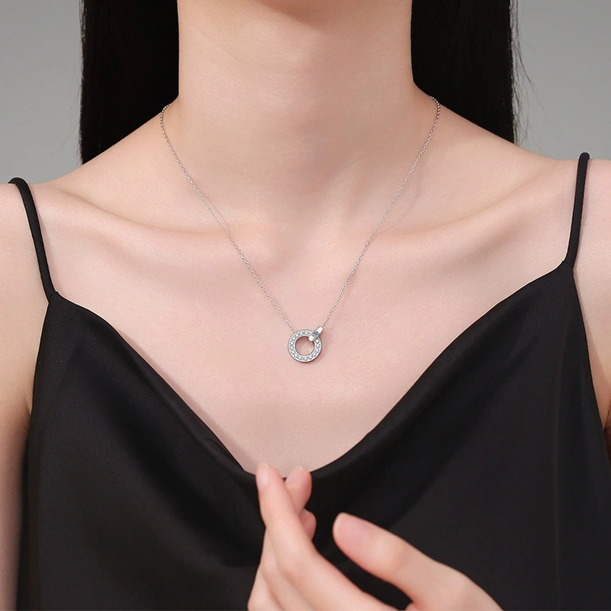 Circle Halo Moissanite Pendant Necklace in Platinum-Plated S925 Sterling Silver worn on neckline by model