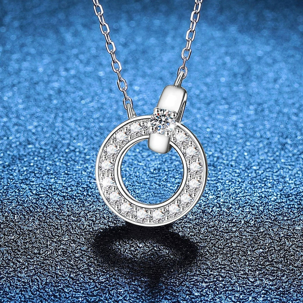 Circle Halo Moissanite Pendant Necklace in Platinum-Plated S925 Sterling Silver blue background angled view