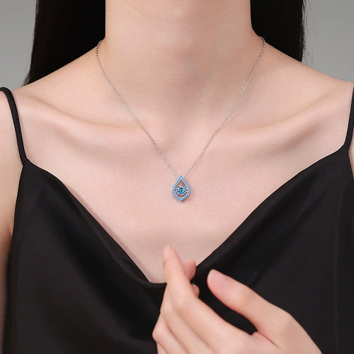 Blue Moissanite Teardrop Pendant Necklace in Platinum-Plated S925 Sterling Silver worn on neckline by model