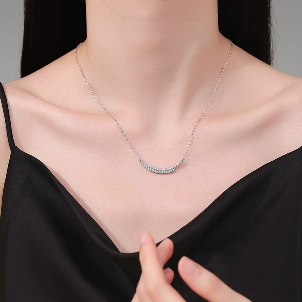 Curved Moissanite Bar Necklace in Platinum-Plated S925 Sterling Silver worn on neckline by model